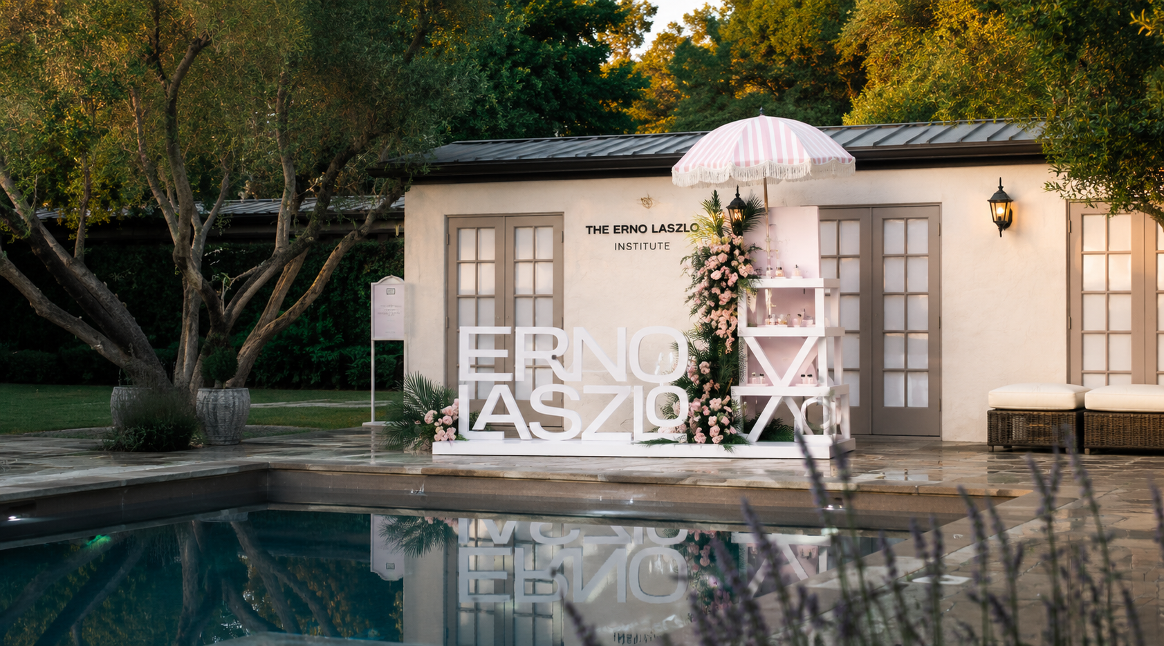 Erno Laszlo Institute exterior with pool, garden, and skincare display.