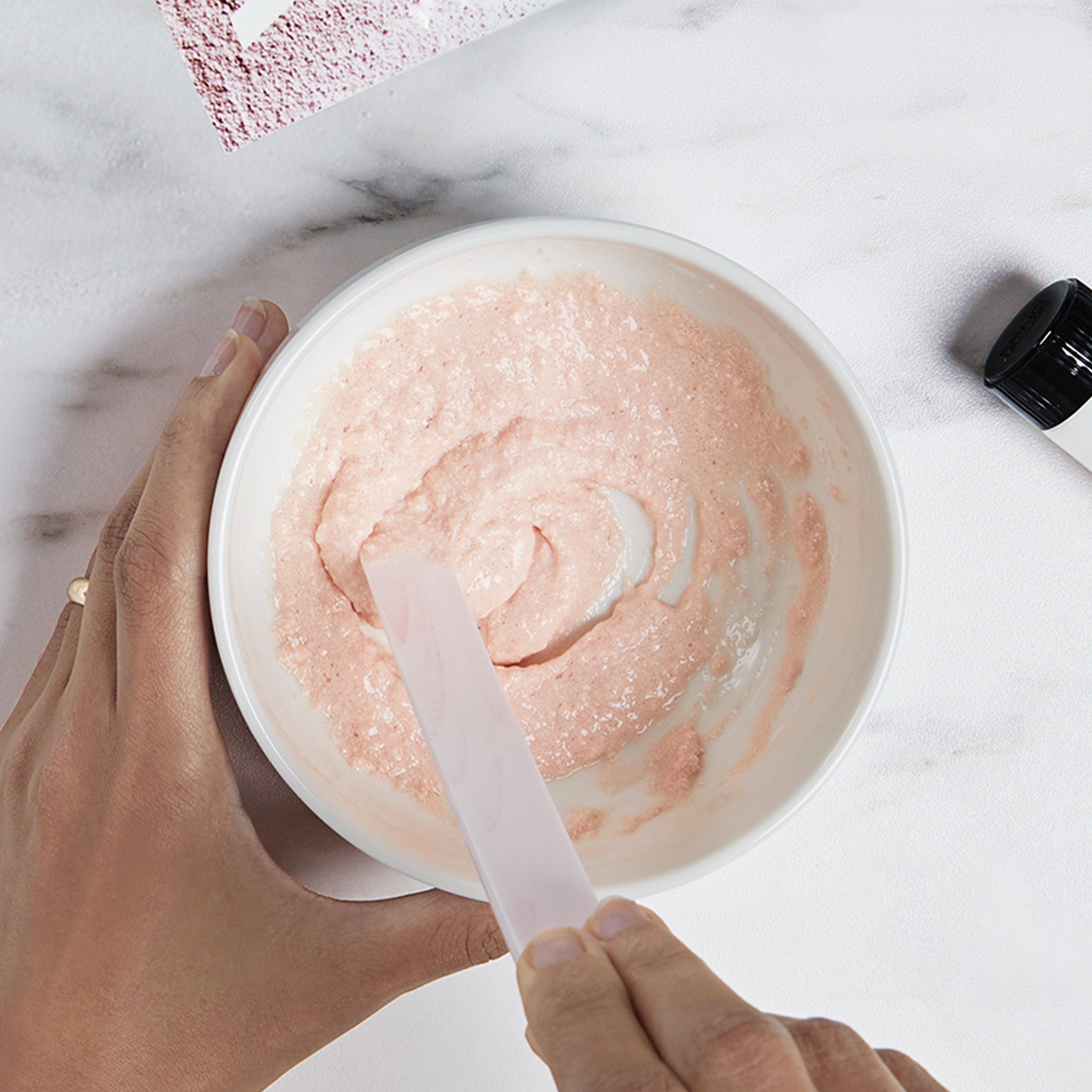Mixing Vitality Treatment Mask in a bowl